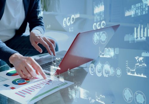 man entering data in to a laptop